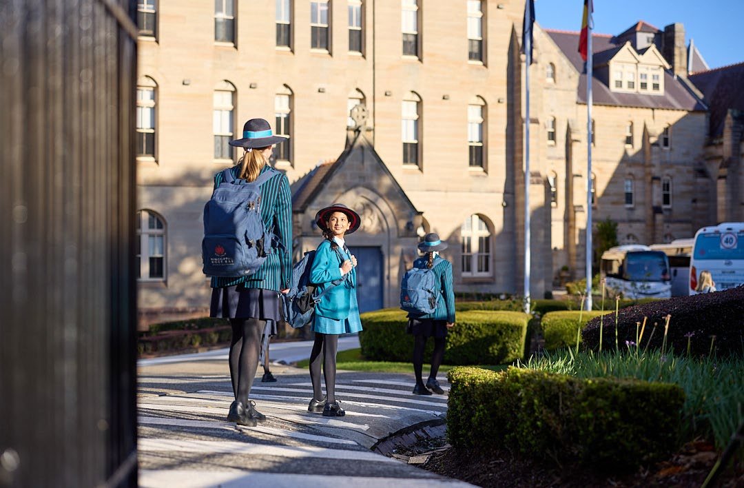 Students together in the sandstone courtyard on KRB’s campus