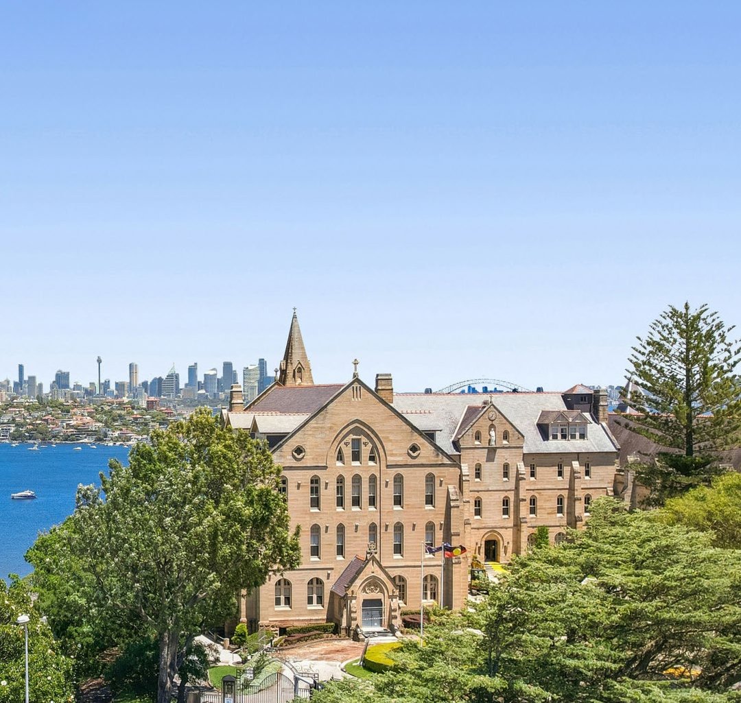 Kincoppal-Rose Bay’s sandstone campus and the Sydney Harbour skyline