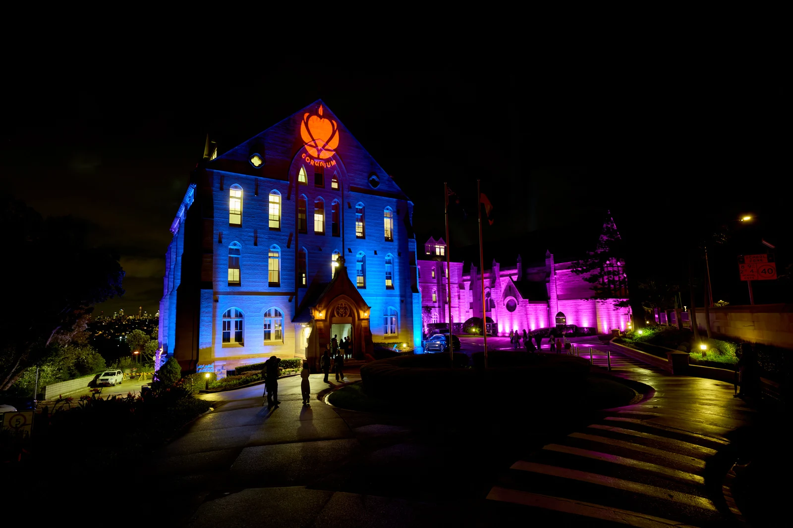 KRB’s campus illuminated in blue and purple at night